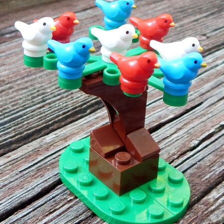 3 Red, 3 White, and 3 Blue LEGO Birds on a tree